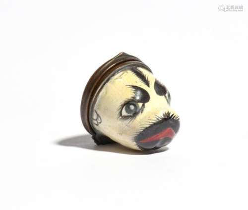 An enamel bonbonnière c.1770-80, modelled as the head of a pug dog, the hinged cover painted with