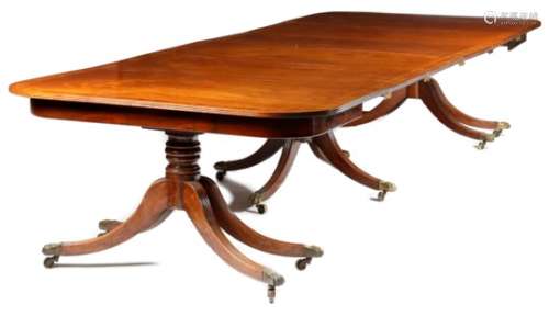λ A George III and later mahogany triple pillar dining table, the reeded edge top with later rod and
