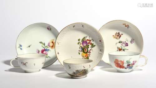 Two German porcelain cups and saucers c.1760, one Höchst and painted with loose flower sprays, the