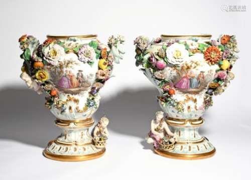 A large and impressive pair of Meissen vases 19th century, of baluster form, painted with figures in