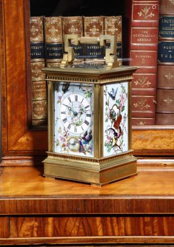 A late 19th century French gilt brass and porcelain mounted carriage clock, the eight day brass