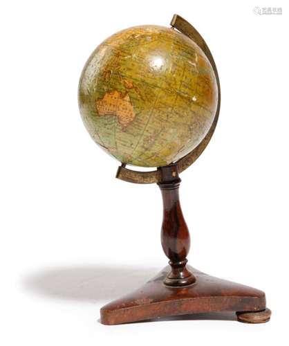 λ A Victorian miniature terrestrial table globe by Wrench, the three inch globe made of twelve