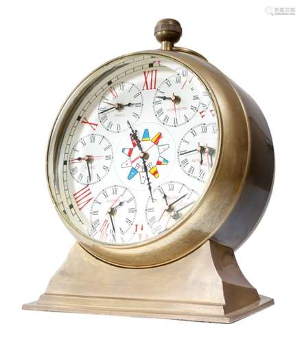 A maritime style brass cased 'world time' table clock, the circular ten inch dial with Roman