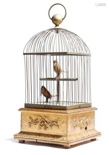 A late 19th century French brass musical automaton group, of two feathered birds in a bird cage, one