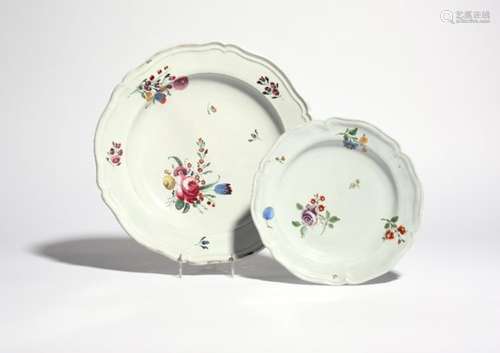 Two Doccia plates c.1760-70, painted with arrangements of European flowers within smaller