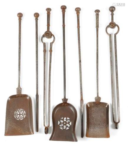 Seven 19th century steel fire irons, with similar ball handles and knopped stems, comprising: