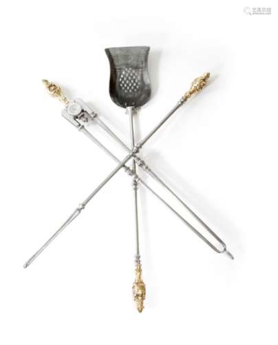 A set of three steel fire irons, each with a brass Rococo style handle, with knopped stems and a