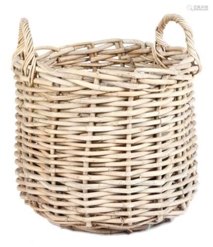 A wicker log basket, with a pair of handles, 78.2cm high, 71.4cm wide.