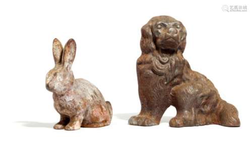 Two Victorian cast iron doorstops, one in the form of a seated spaniel, the other a bunny rabbit,