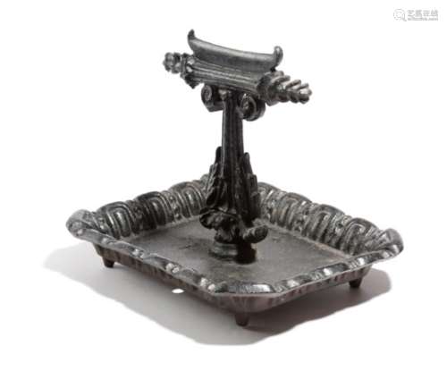 A Victorian cast iron boot scraper, painted black, with a leaf and scroll decoration, 26.6cm high,