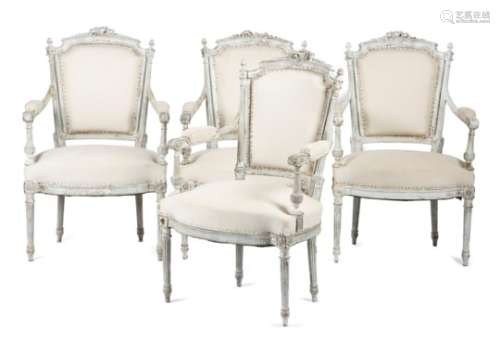 A set of four 19th century French white painted fauteuils in Louis XVI style, the moulded and fluted