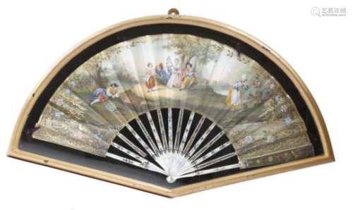 A continental painted and gilt fan, the leaf decorated with a woodland scene of figures dancing