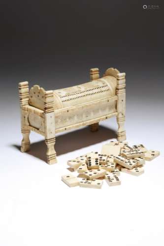 An early 19th century French Napoleonic bone prisoner of war games box, in the form of a bed, the