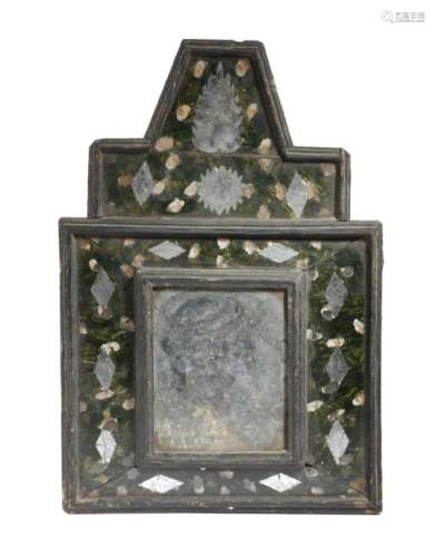 An early 18th century Dutch ebonised pine and reverse painted wall mirror, with a rectangular plate,