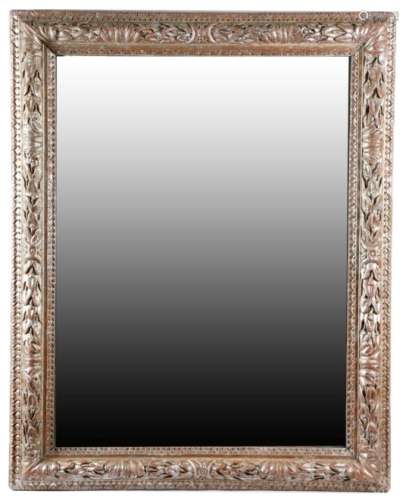 An 18th century Italian silvered wood wall mirror, the later rectangular plate within a moulded slip
