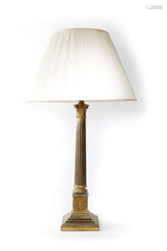 A Victorian Corinthian column table lamp, the fluted stem above laurel wreaths and a beaded