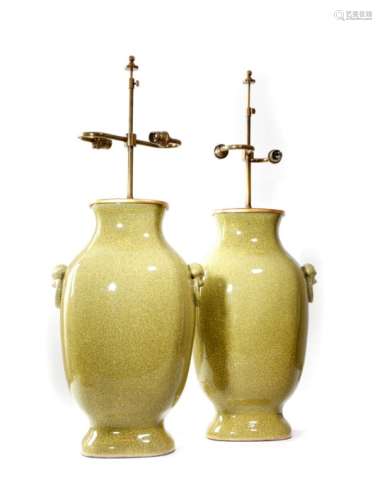 A pair of large pottery crackle glaze table lamps in Chinese style, each with twin lights and with