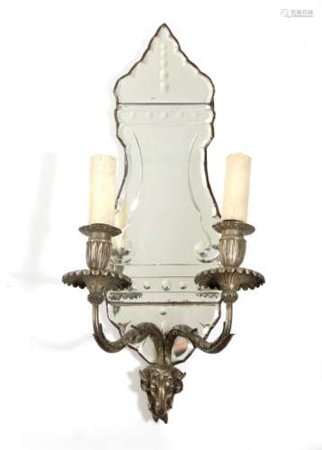 A silvered brass twin-light wall sconce in George III style, the mirrored cut-glass backplate