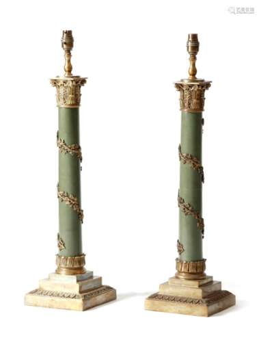 A pair of brass column table lamps, each with a palmette decorated capital, above a grapevine