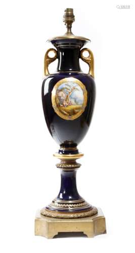 A late 19th century French porcelain table lamp in Sθvres style, gilt decorated on a bleu de roi