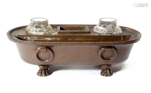 An early 19th century Italian bronze Grand Tour inkstand in the form of a Roman bath, with a pair of