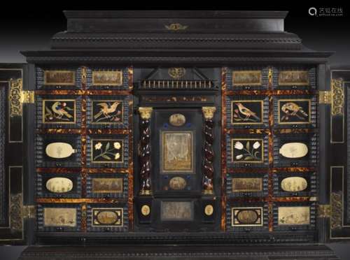 λ A Flemish ebony cabinet on chest, decorated with ripple mouldings and raised panels, the hinged