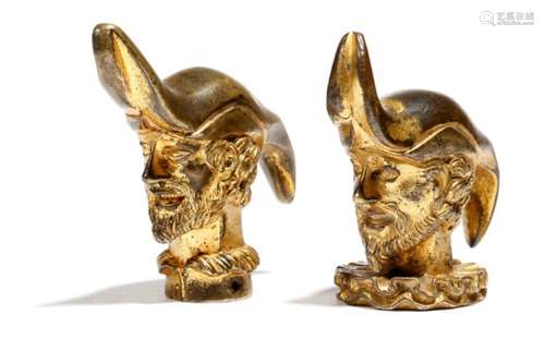 Two similar Italian gilt bronze finials, each in the form of a bust of a bearded male, sporting an