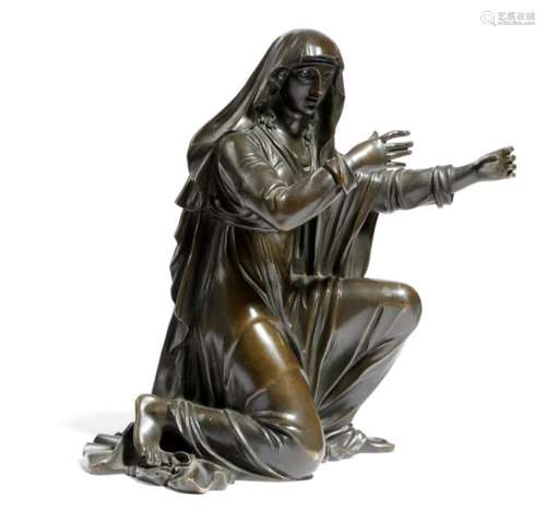 An early 19th century French bronze model of a lady, kneeling and wearing a veiled cloak, 16.4cm