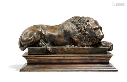 After Antonio Canova (Italian 1757-1822). A bronze Grand Tour model of a recumbent lion, on a