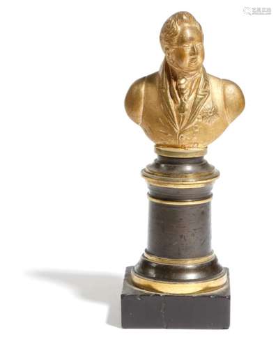 An early 19th century gilt bronze portrait bust of a gentleman, wearing the Star of the Garter, on a