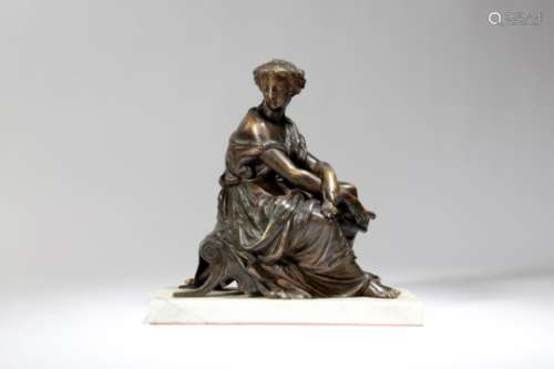 A 19th century French bronze figure of a classical lady, seated on a stool, holding a letter and