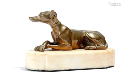 A Regency gilt bronze model of a recumbent greyhound, mounted on an alabaster plinth, 10.5cm high,
