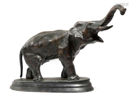 A late 19th century bronze animalier model of an elephant, standing on an ebonised wood base, 25cm