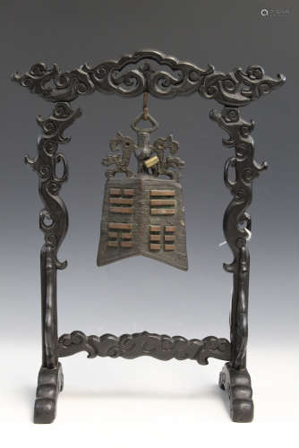 Chinese bronze temple bell in wood frame.