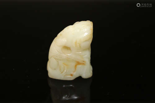Chinese white jade toggle of a foo dog.