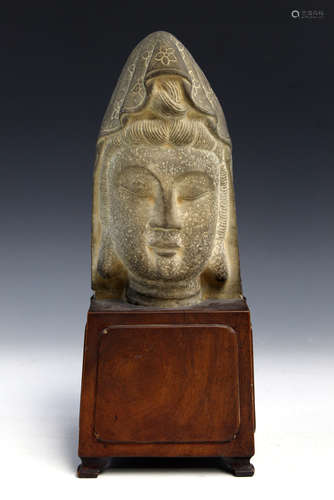 Chinese carved stone statue of Buddha head on wood