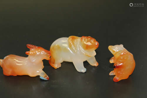 Three agate animal figurines