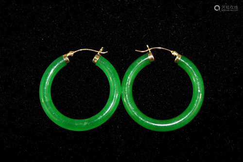 A pair of Chinese jadeite 14 K gold earrings.