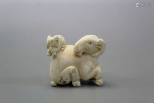A Japanese carved figurine of goat.