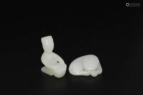 Two Chinese white jade carvings.