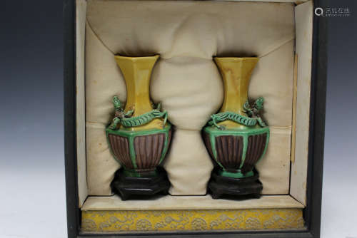 Pair of Chinese Sancai vases on wood stands in a box,