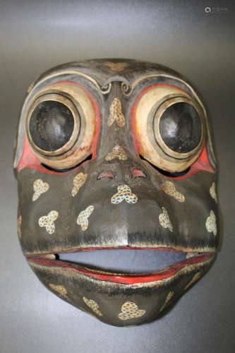 Japanese wood mask of a monkey.