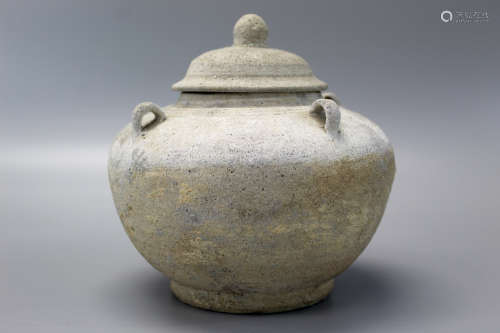 Pottery jar with cover.