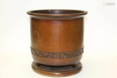 Japanese bronze planter with wood base.