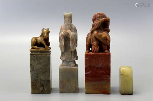 Four Chinese carved soapstone seals.