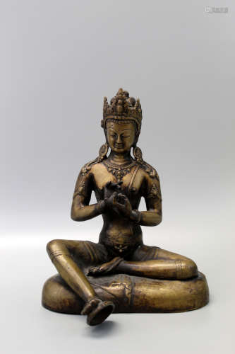 A Tibetan bronze statue.