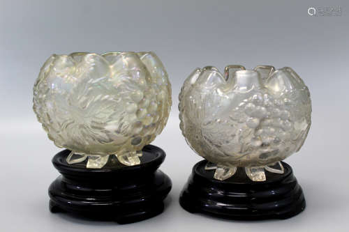A pair of grape delight glass vases on stands.
