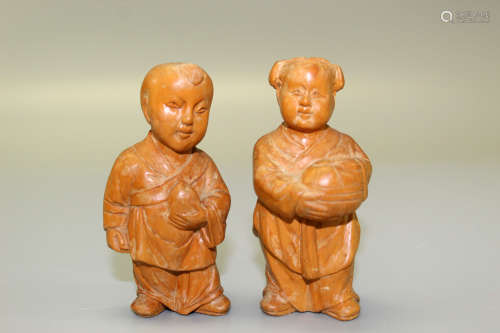 Two Chinese carved wood children figurines.