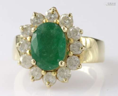 Tested as 18ct yellow gold emerald and diamond oval cluster ring, finger size L, weight 9.6g