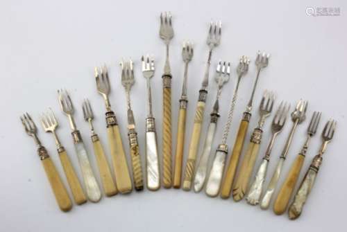 Eighteen silver & white metal pickle forks, with bone, mother of pearl, etc. handles, mostly